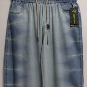 Men wearing neon blue baggy fit jeans with dual white side stripes and oversized sneaker